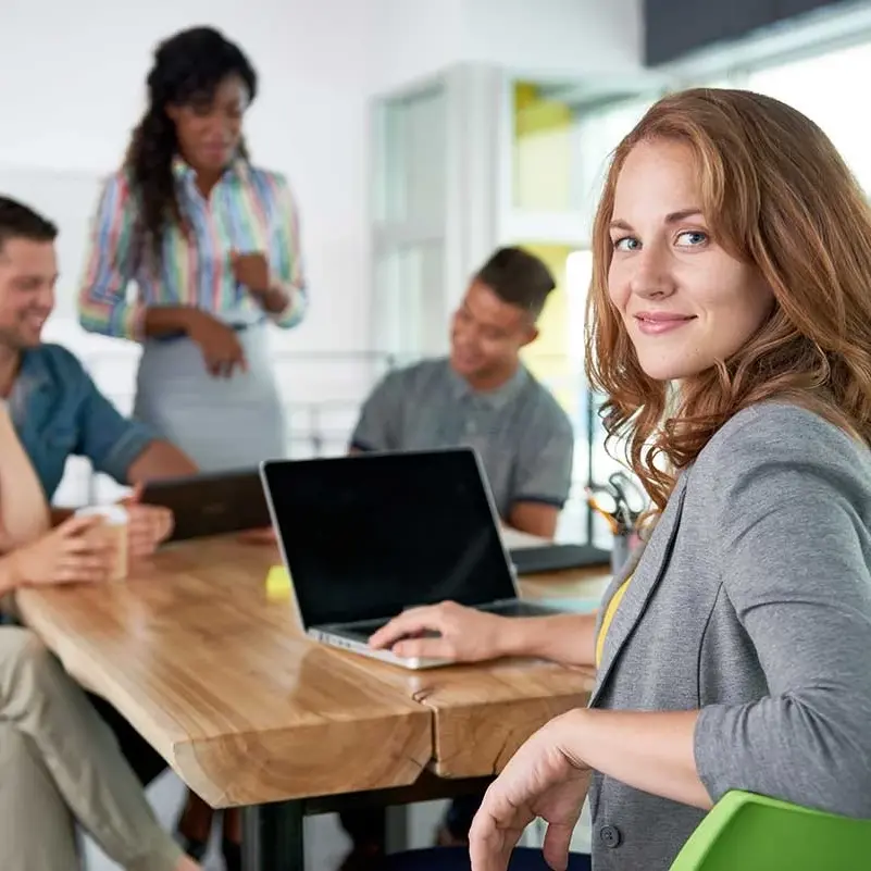 Women at table with laptop conducting business